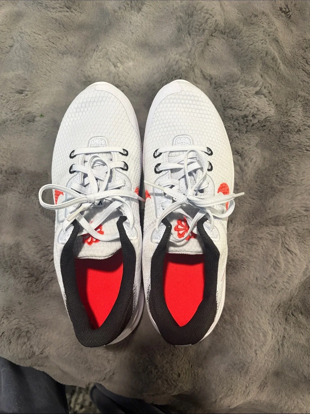 Nike Kids White Sneakers with Red Swoosh and Black Heel